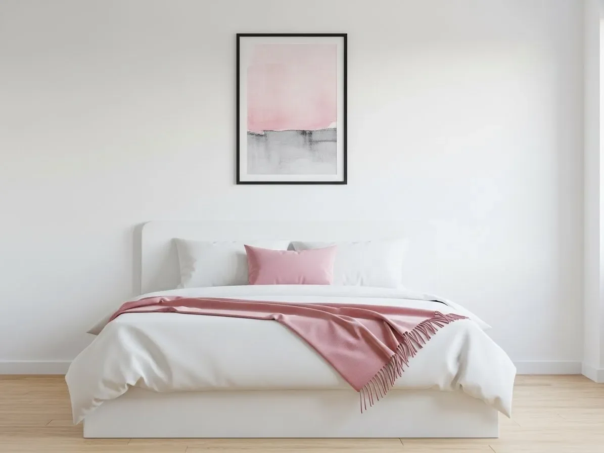 Minimalist bedroom with subtle pink accents and clean décor.